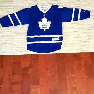 Blue and white Reebok Toronto Maple leafs jersey.